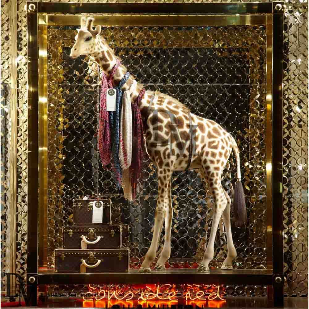 Fiberglass life size giraffe for Visual Merchandising in retail window. You  can put the scarf, belt o…